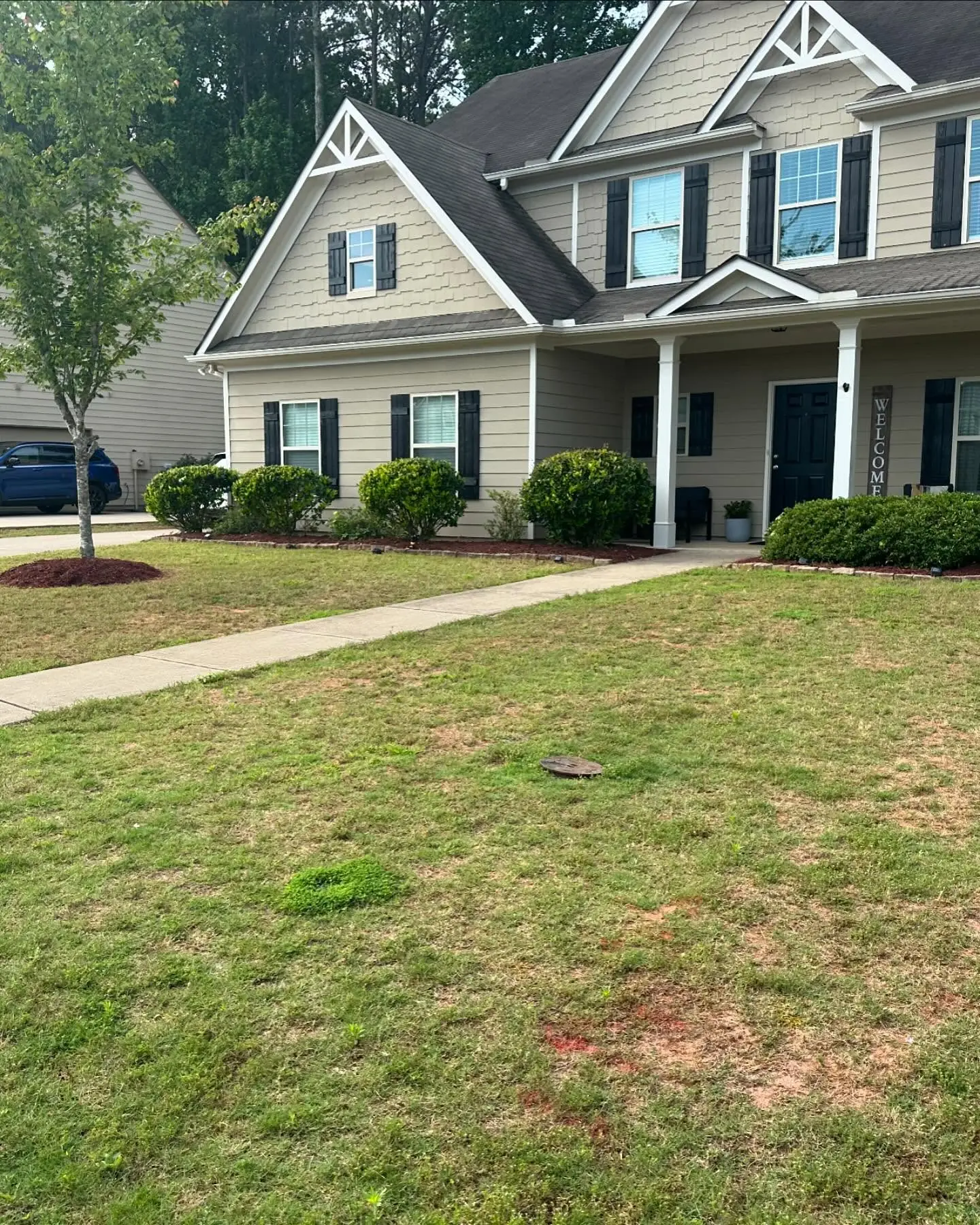 Freshly mowed front lawn with clean mower stripes at a Marietta, GA home