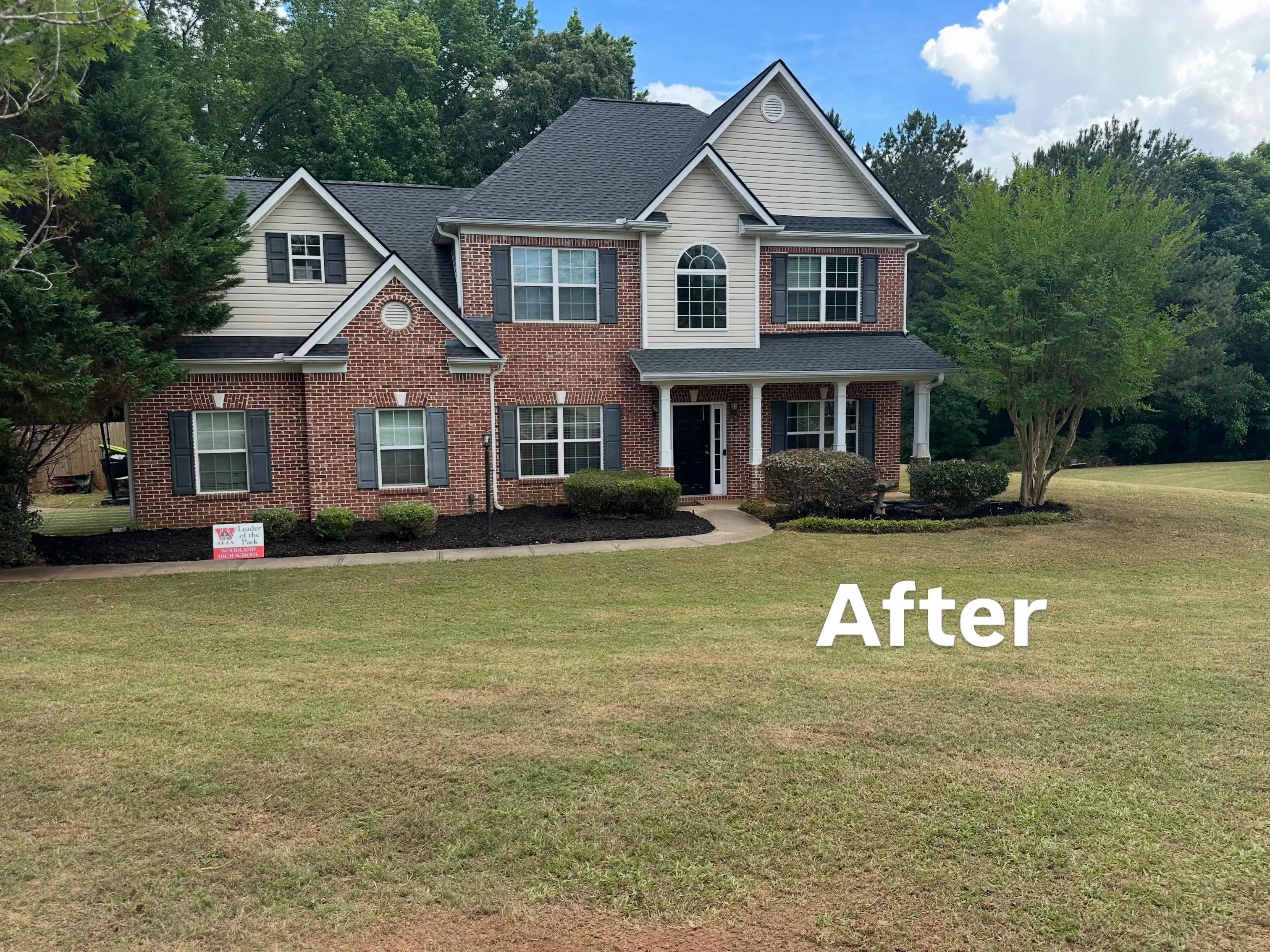 Same Marietta, GA front lawn after mowing, edging, and bed cleanup by D.G. Property Management