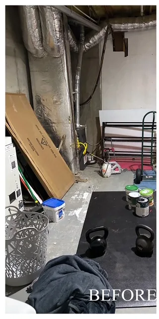 Cluttered basement storage area before a Marietta, GA cleanout